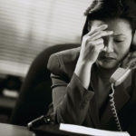 Frustrated Businesswoman on Telephone